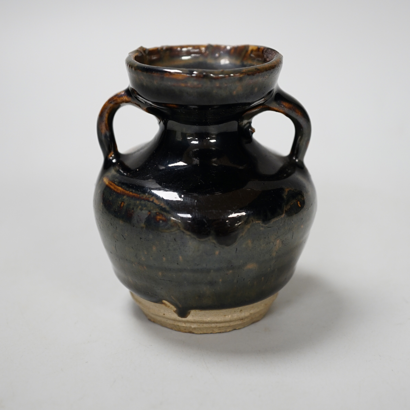 A Chinese Jian type two handled jar, possibly Song dynasty, 8cm high